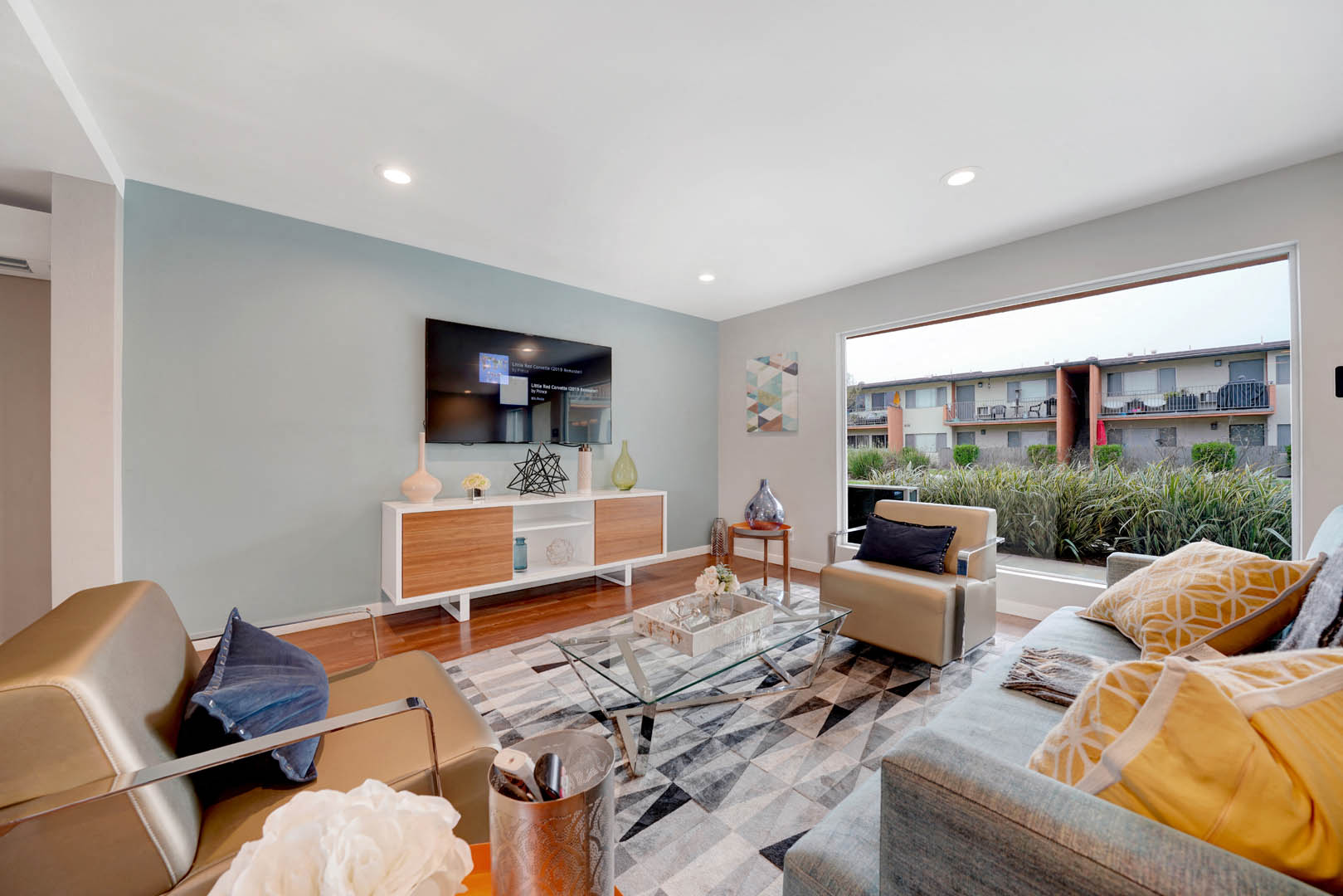 a living room with furniture and a large window